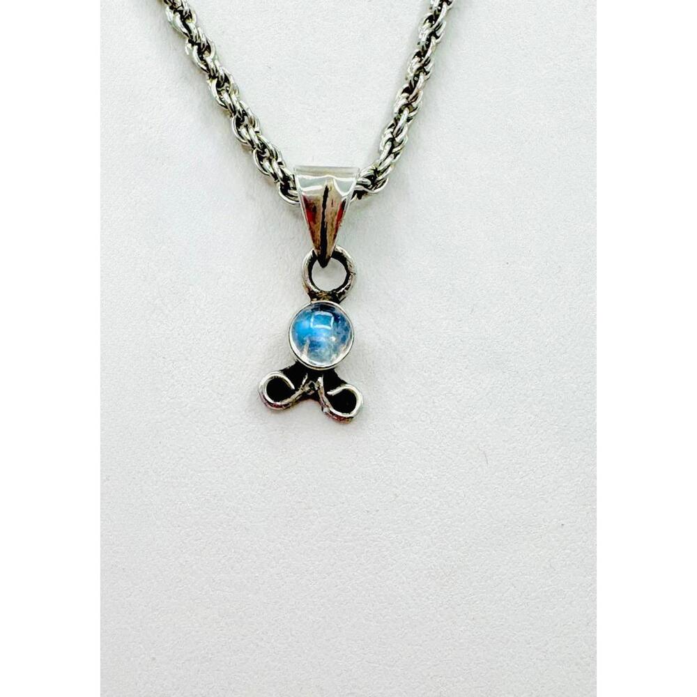 Silver tone rope chain stick figure with blue gemstone pendant necklace